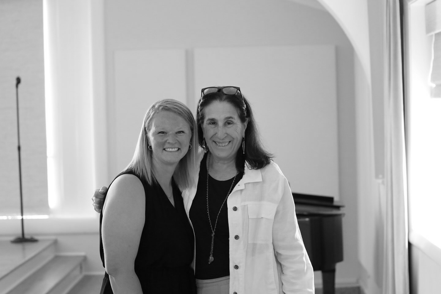 Two women smiling posing for a picture